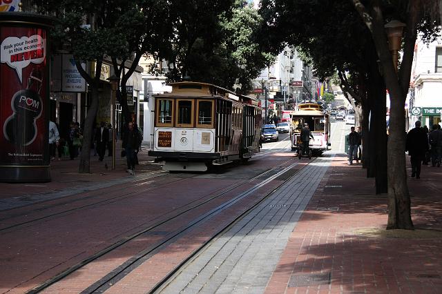 IMG_1139.JPG - San Francisco's famous cable cars have been in operation since 1873.  They're hauled along by an underground cable.  If you peer down the middle "track" you can hear and see the cable zipping along.
